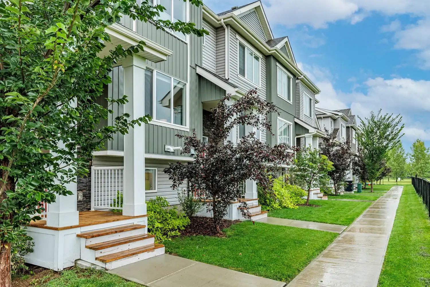 View after rain of lovely row home complex in Calgary.