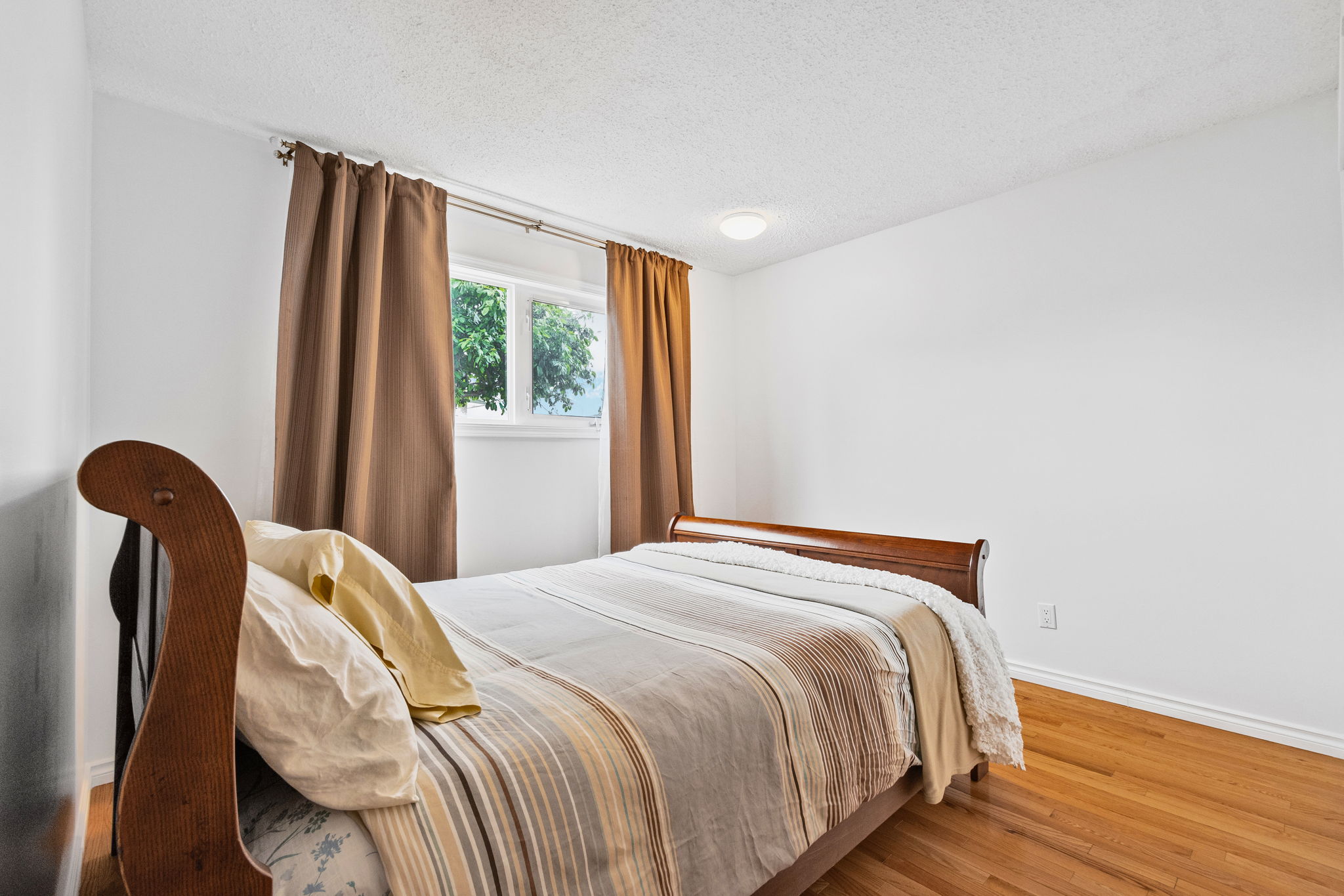 Family room with fireplace at 10715 33 Ave NW Edmonton