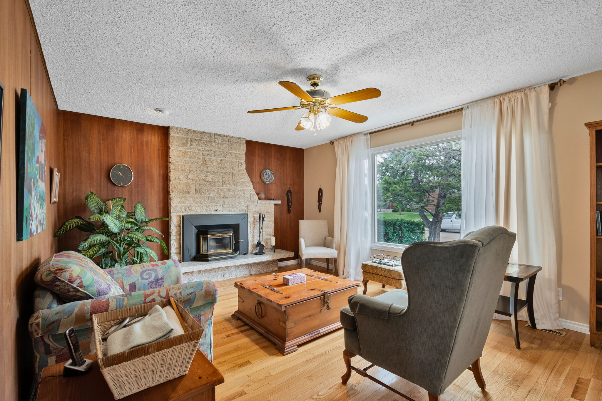 Family room with fireplace at 10715 33 Ave NW Edmonton
